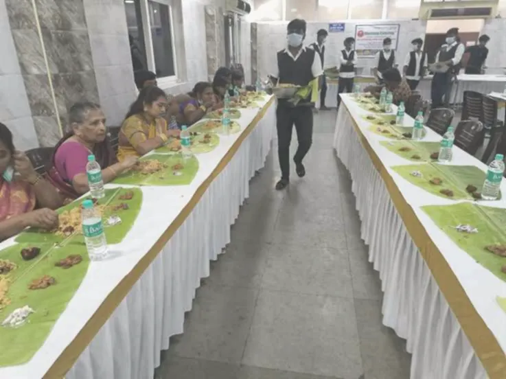 Banana leaf rows laid out in a hall